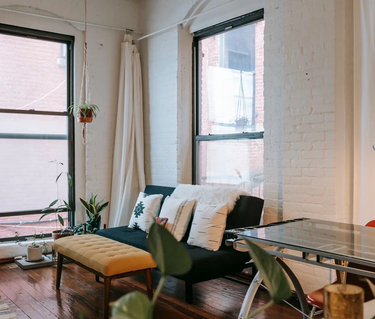 A loft living room with tall windows. Example photo, not a listing.